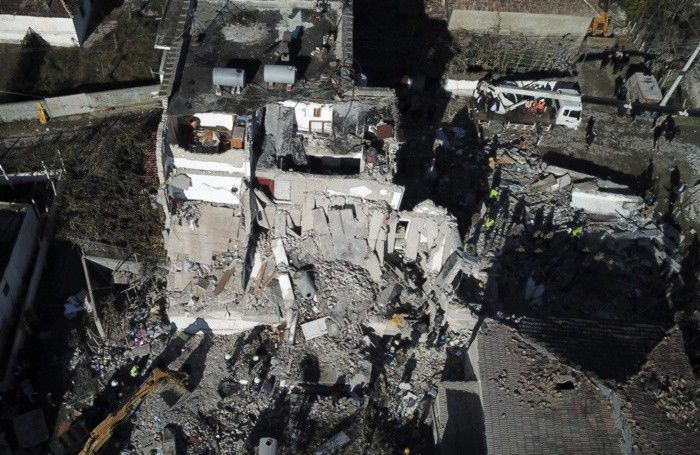 Rescuers search at a damaged building after a magnitude 6.4 earthquake in Thumane, western Albania, Rescuers search at a damaged building after a magnitude 6.4 earthquake in Thumane, western Albania,