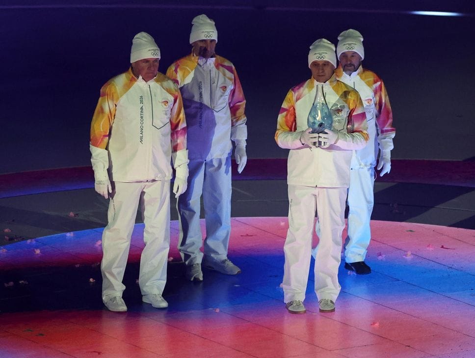 Lillehammer 1994 Olympic champions, cross-country skiing 4x10km relay, Maurilio De Zolt, Marco Albarello, Giorgio Vanzetta, and Silvio Fauner carrry the Olympic flame during the Closing Ceremony of the Milano Cortina 2026 Winter Olympic Games, in Verona, Italy, 22 February 2026
